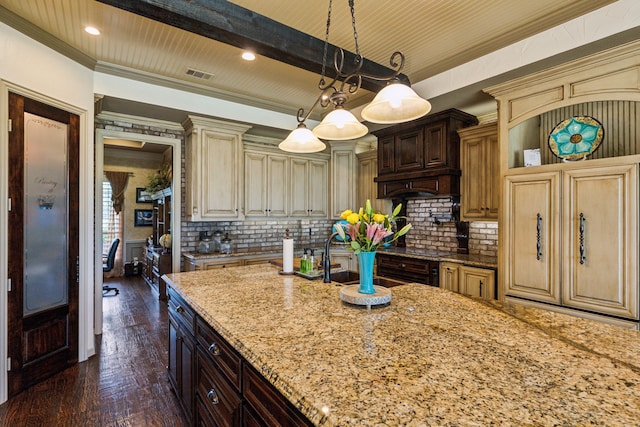 3060 Anna Cade Cir, Rockwall, TX 75087 - kitchen with light stone counters, dark wood finished floors, backsplash, hanging light fixtures, and crown molding