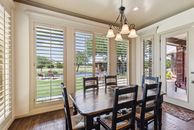 3060 Anna Cade Cir, Rockwall, TX 75087 - dining space featuring a chandelier, dark wood finished floors, healthy amount of natural light, and ornamental molding