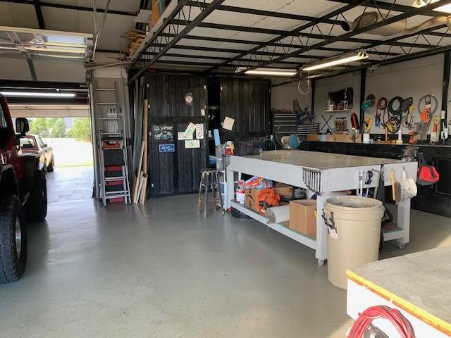 3060 Anna Cade Cir, Rockwall, TX 75087 - garage featuring a workshop area