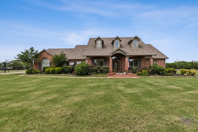 3060 Anna Cade Cir, Rockwall, TX 75087 - cape cod home with brick siding, a front lawn, roof with shingles, and a porch