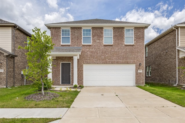 2115 Revere Dr, Princeton, TX 75407 - traditional-style house featuring an attached garage, brick siding, concrete driveway, and a front lawn