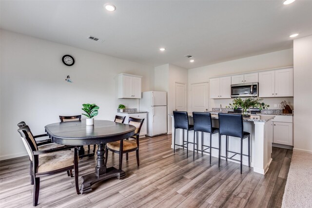 2115 Revere Dr, Princeton, TX 75407 - dining area with light wood-style floors, recessed lighting, and baseboards