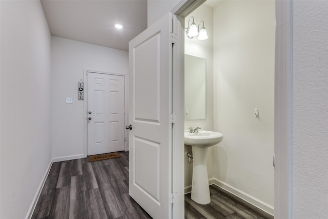 2115 Revere Dr, Princeton, TX 75407 - bathroom featuring wood finished floors, baseboards, and a sink