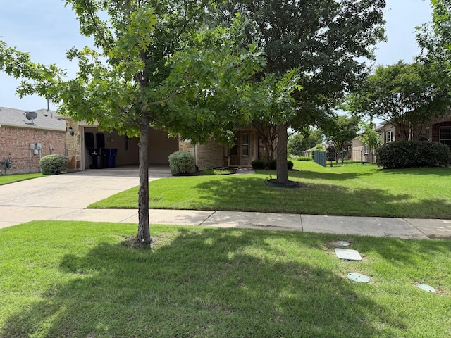 7421 Kite Ln, Frisco, TX 75036 - view of property hidden behind natural elements with driveway, a front lawn, and brick siding
