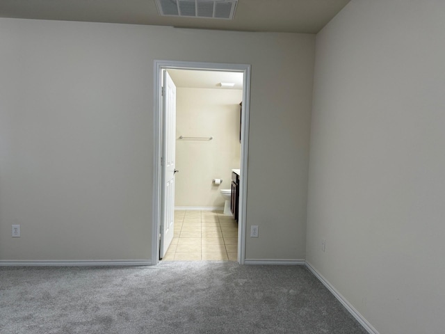 7421 Kite Ln, Frisco, TX 75036 - unfurnished room featuring light carpet, light tile patterned floors, and baseboards