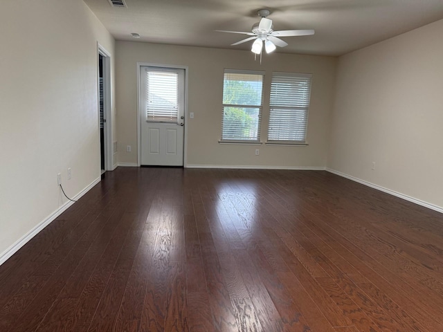 7421 Kite Ln, Frisco, TX 75036 - spare room with ceiling fan, dark wood finished floors, and baseboards