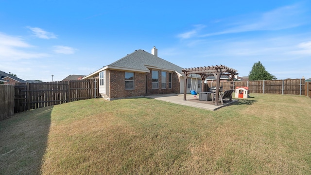109 Harvest Way, Crandall, TX 75114 - back of house featuring a pergola, a patio, brick siding, and a chimney