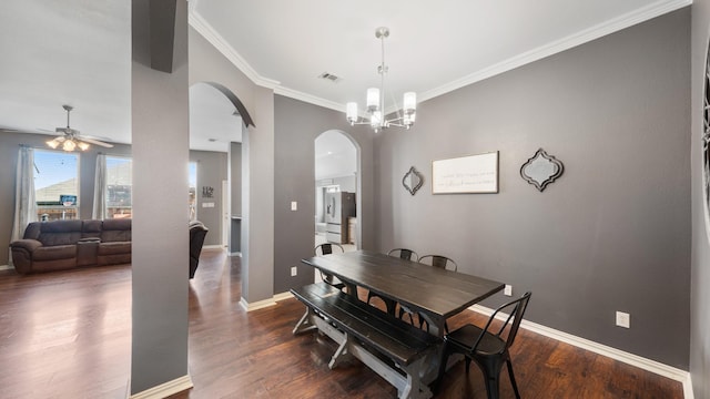 109 Harvest Way, Crandall, TX 75114 - dining room featuring arched walkways, crown molding, baseboards, a ceiling fan, and dark wood-type flooring