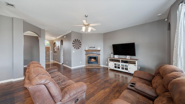 109 Harvest Way, Crandall, TX 75114 - living room featuring arched walkways, a ceiling fan, baseboards, and wood finished floors