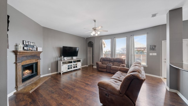 109 Harvest Way, Crandall, TX 75114 - living area with a lit fireplace, wood finished floors, ceiling fan, and baseboards