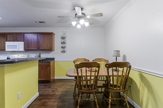 819 Earhart Ave, Grand Prairie, TX 75051 - dining space featuring baseboards, crown molding, dark wood-style flooring, and a ceiling fan