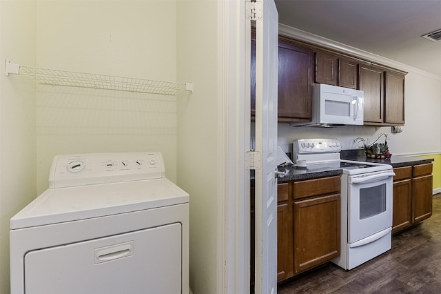 819 Earhart Ave, Grand Prairie, TX 75051 - kitchen with white appliances, washer / clothes dryer, dark wood-style floors, and dark countertops