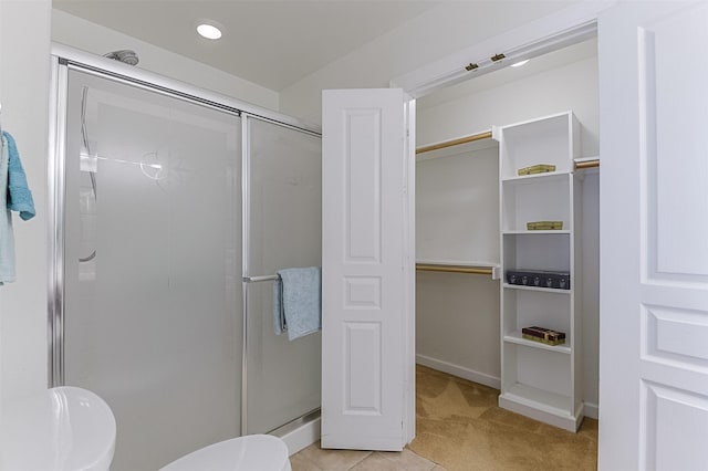 819 Earhart Ave, Grand Prairie, TX 75051 - bathroom with a stall shower, toilet, a walk in closet, and baseboards