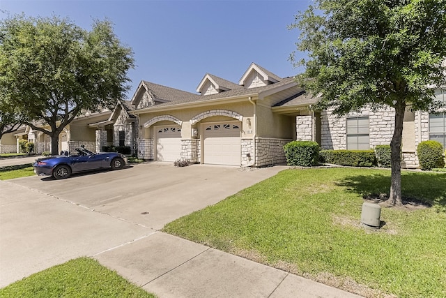 819 Earhart Ave, Grand Prairie, TX 75051 - view of front of property featuring stone siding, driveway, a garage, a front yard, and stucco siding