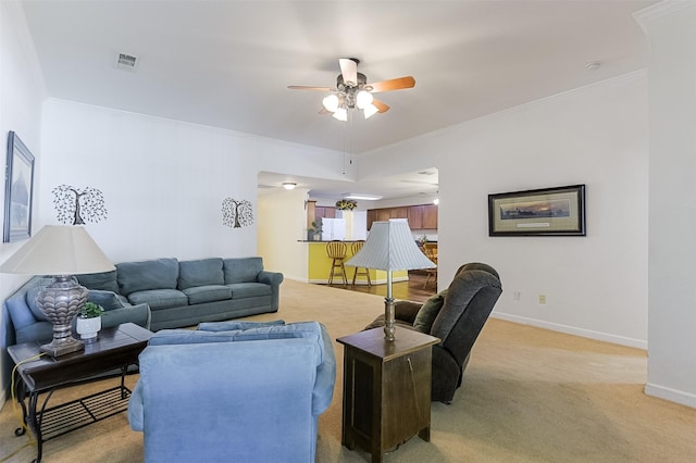 819 Earhart Ave, Grand Prairie, TX 75051 - living area with a ceiling fan, baseboards, light colored carpet, and ornamental molding