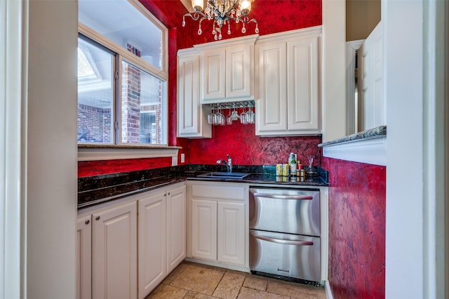 4 Rushing Meadow Ct, Dalworthington Gardens, TX 76016 - kitchen featuring a sink, dishwasher, a chandelier, and white cabinetry
