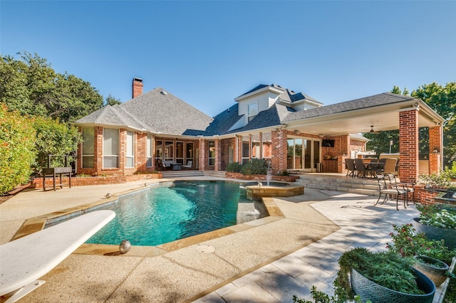 4 Rushing Meadow Ct, Dalworthington Gardens, TX 76016 - view of pool with a patio area, a pool with connected hot tub, outdoor dining area, and a diving board
