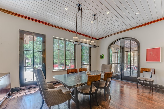 dining area featuring crown molding, hardwood / wood-style floors, recessed lighting, wooden ceiling, and french doors