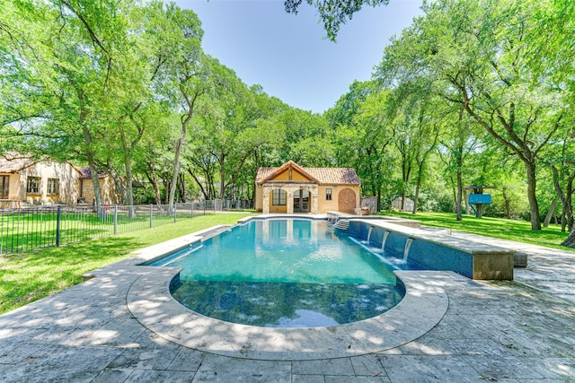 view of swimming pool with a storage structure, an outbuilding, and a patio