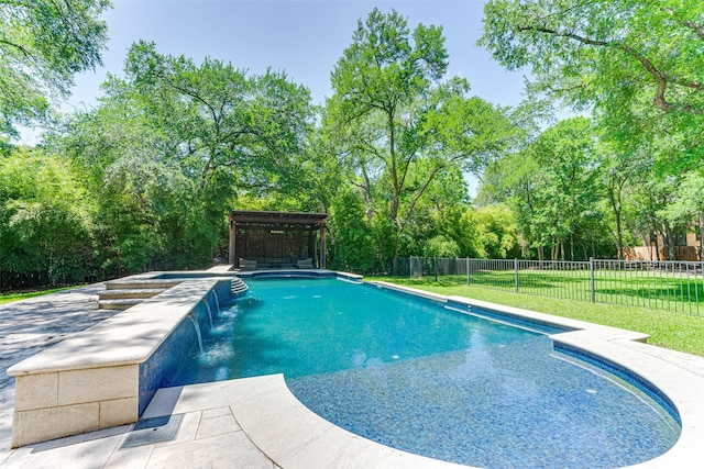 view of pool featuring a hot tub, view of scattered trees, and a patio area