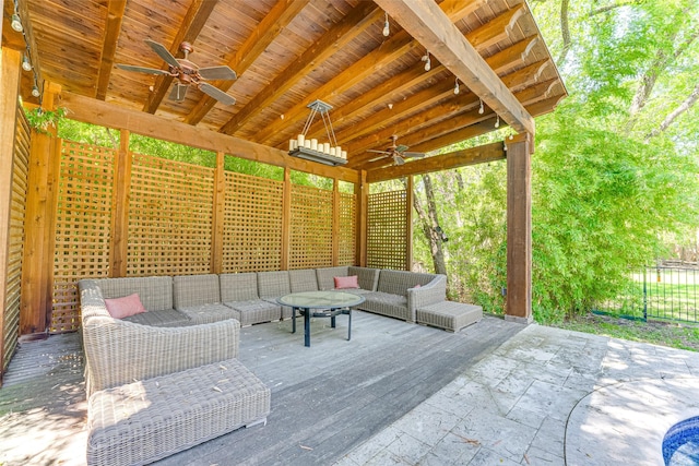view of patio with a ceiling fan, outdoor lounge area, fence, and a deck