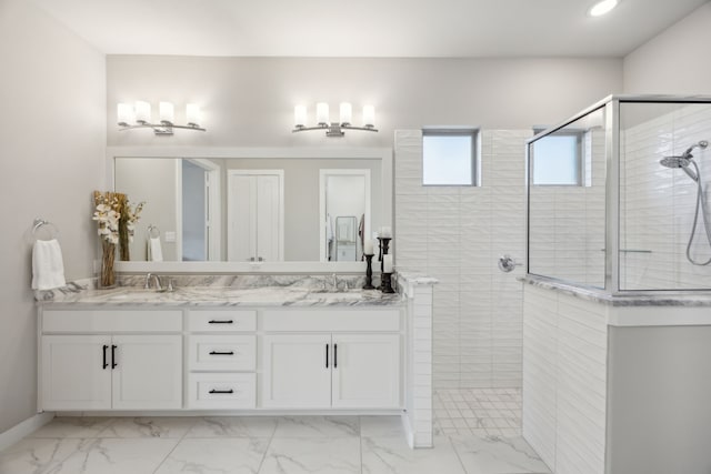 bathroom with a walk in shower, marble look tiles, double vanity, recessed lighting, and baseboards