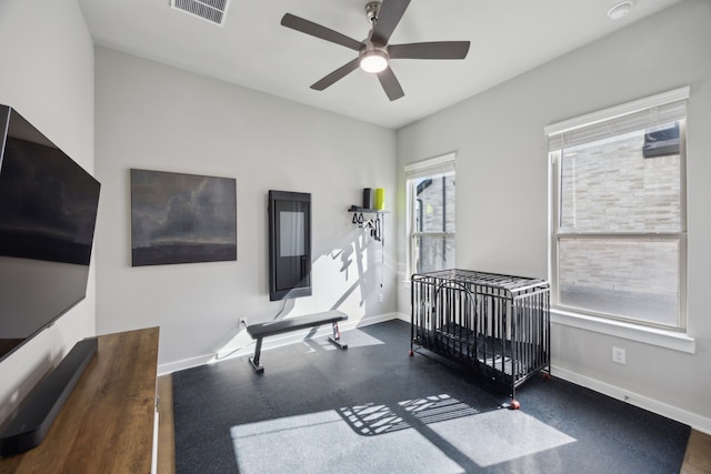 bedroom with baseboards and ceiling fan