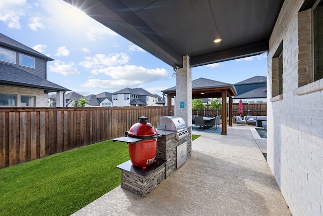 view of patio with area for grilling, a gazebo, an outdoor hangout area, and a residential view