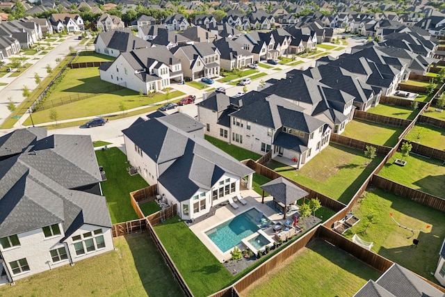aerial view of residential area with a pool area