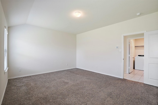 2302 Torch Lake Dr, Forney, TX 75126 - spare room featuring washer / dryer, light colored carpet, lofted ceiling, baseboards, and a smoke detector