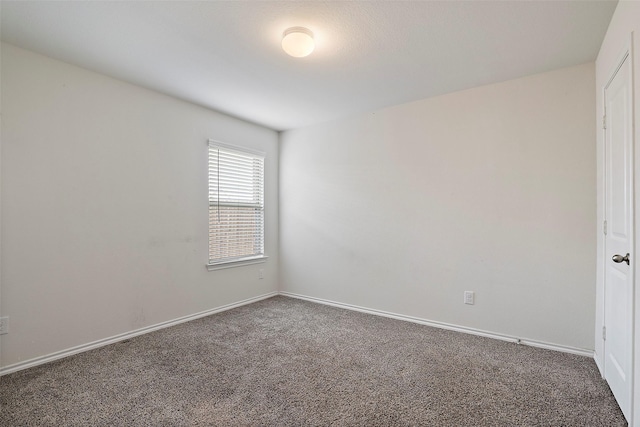 2302 Torch Lake Dr, Forney, TX 75126 - spare room featuring carpet and baseboards