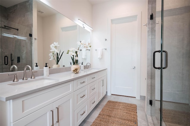 full bath with a stall shower and double vanity