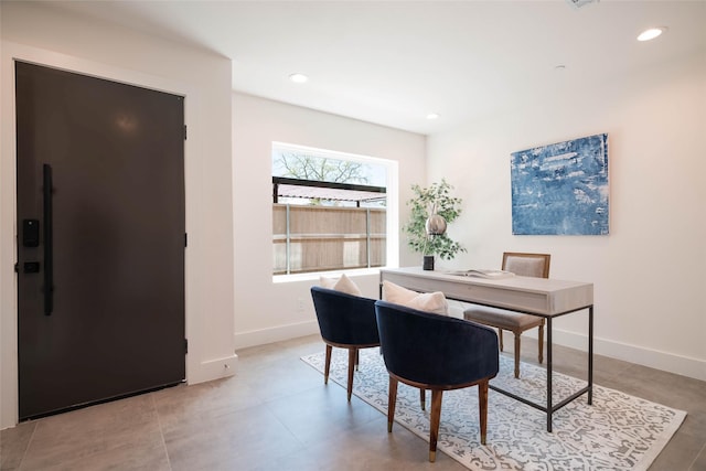 office space with baseboards and recessed lighting