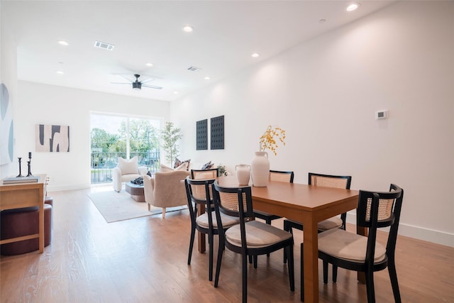 dining room with ceiling fan, recessed lighting, light wood-type flooring, and baseboards