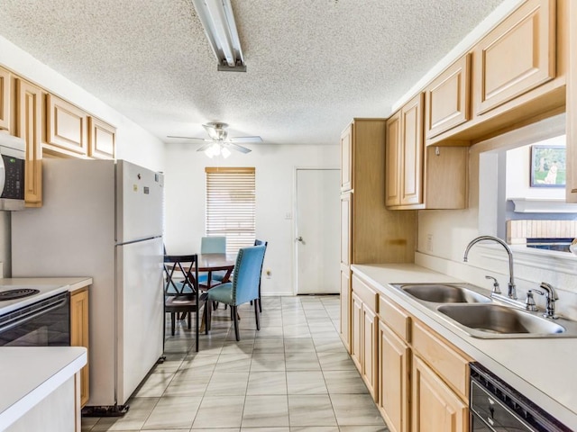 202 Lancelot Dr, Weatherford, TX 76086 - kitchen with a sink, black dishwasher, light countertops, and a textured ceiling
