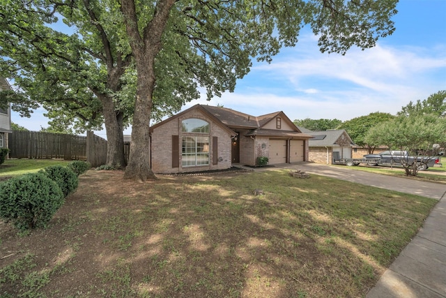 2802 Glen Ridge Dr, Arlington, TX 76016 - view of front of home with driveway, brick siding, and an attached garage
