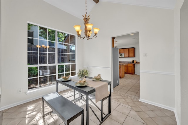 2802 Glen Ridge Dr, Arlington, TX 76016 - dining space featuring a chandelier, light tile patterned flooring, and baseboards
