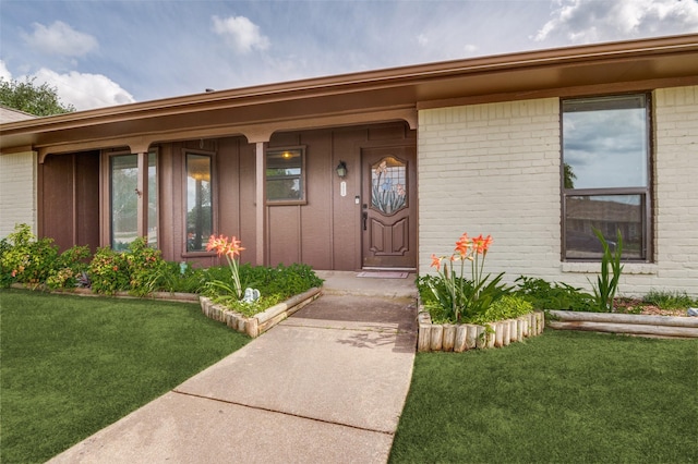 2800 Peachtree Ln, Pantego, TX 76013 - property entrance with brick siding, a lawn, board and batten siding, and a porch
