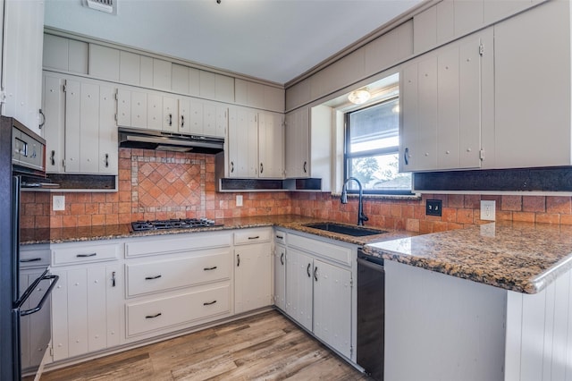 2800 Peachtree Ln, Pantego, TX 76013 - kitchen with a sink, stainless steel gas cooktop, decorative backsplash, and white cabinets