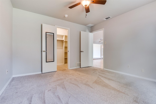 2800 Peachtree Ln, Pantego, TX 76013 - unfurnished bedroom with carpet flooring, a walk in closet, baseboards, and ceiling fan
