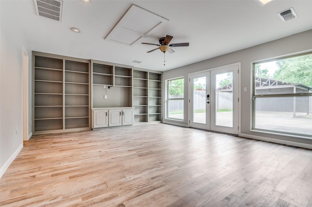 2800 Peachtree Ln, Pantego, TX 76013 - unfurnished living room featuring plenty of natural light, light wood-style flooring, a ceiling fan, and french doors