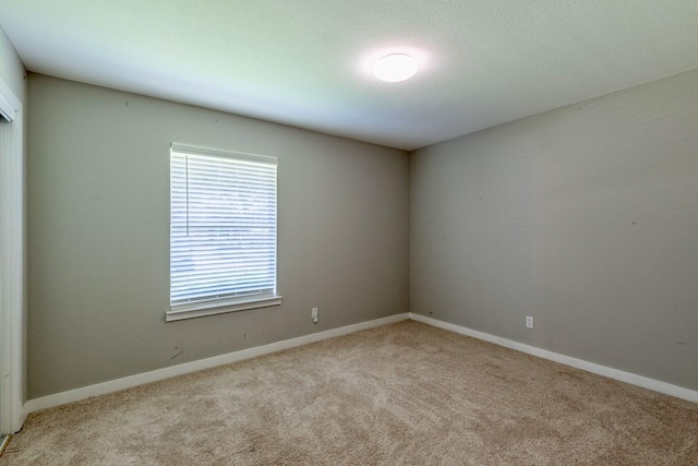 1708 Bardfield Ave, Garland, TX 75041 - carpeted empty room featuring baseboards