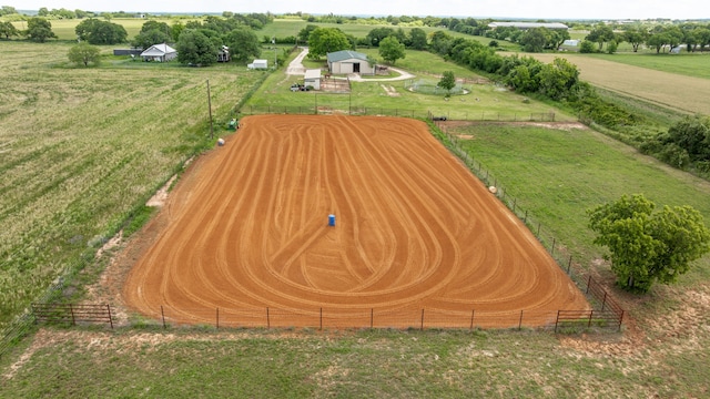 1545 County Road 130, Stephenville, TX 76401 - entry to storm shelter with a rural view, an outdoor riding arena, and fence