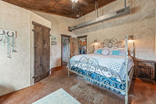 1545 County Road 130, Stephenville, TX 76401 - bedroom with finished concrete flooring, wooden ceiling, a textured wall, and a high ceiling