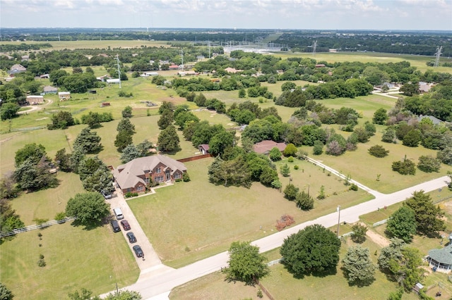 drone / aerial view of a tree filled landscape