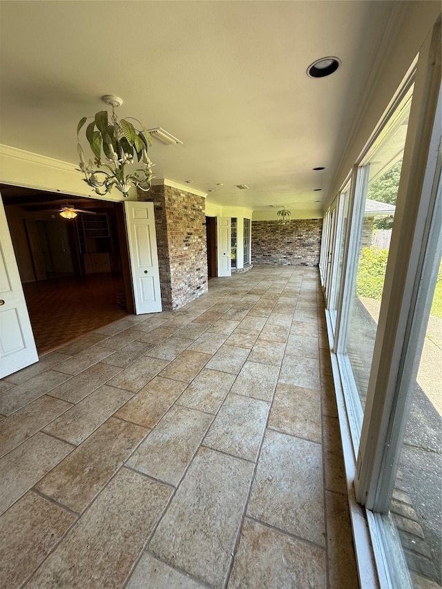 8309 Ashbourne Dr, Shreveport, LA 71106 - unfurnished sunroom with a chandelier