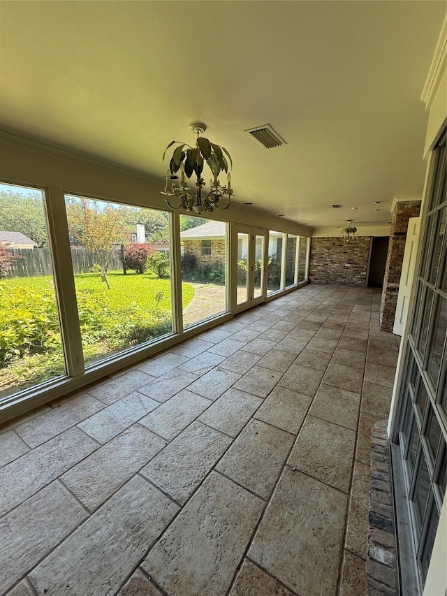 8309 Ashbourne Dr, Shreveport, LA 71106 - unfurnished sunroom featuring a chandelier and french doors
