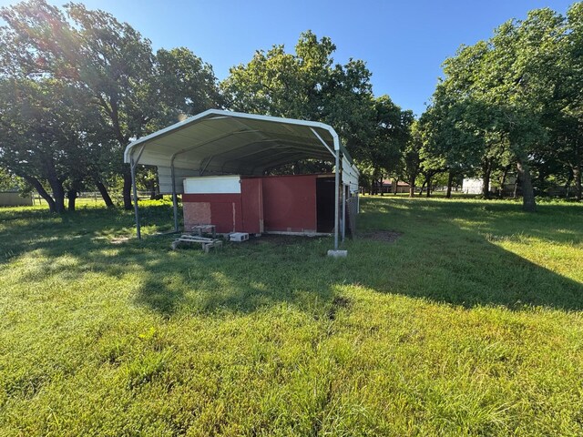 1946 US Highway 380 E, Graham, TX 76450 - view of green lawn with a detached carport