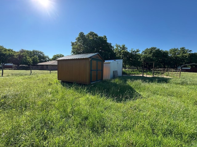 1946 US Highway 380 E, Graham, TX 76450 - view of yard featuring a storage unit, an outbuilding, and fence