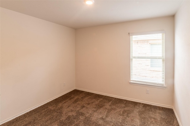 3929 Dickinson Ave, Aubrey, TX 76227 - spare room with dark colored carpet and baseboards